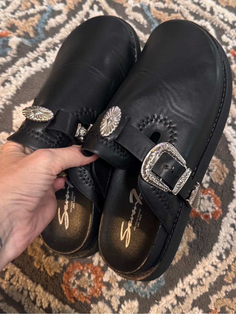 Seven Black Leather Buckle Clog Mules with Silver Accents